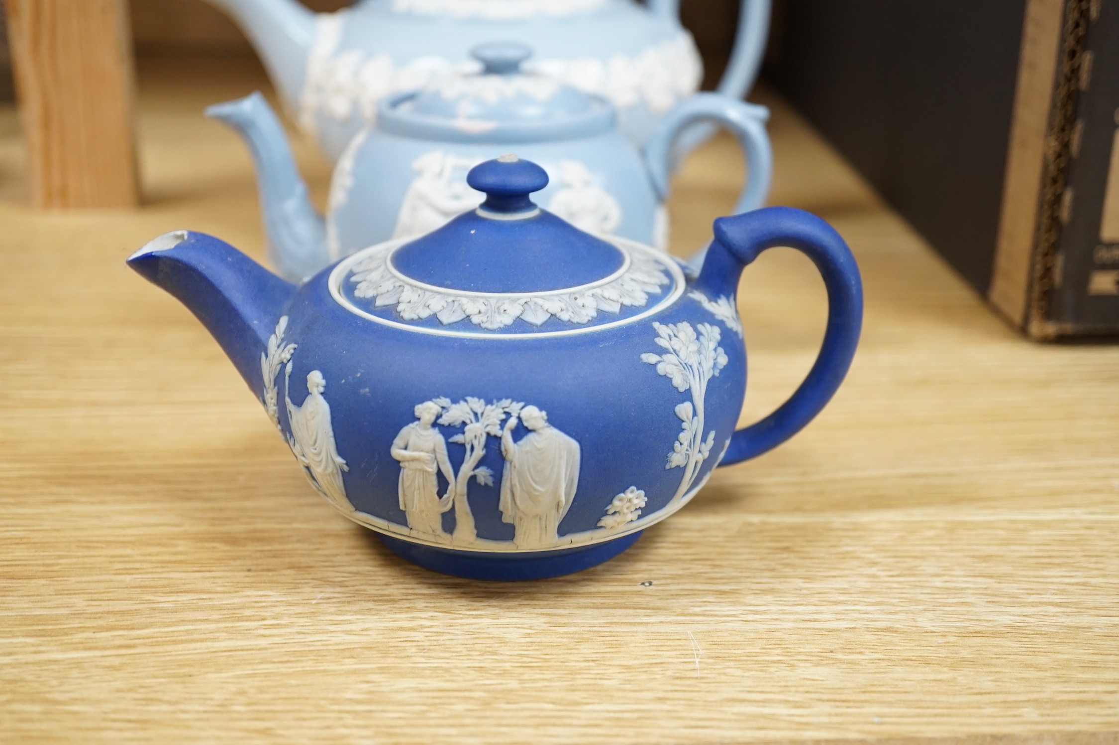 A group of Wedgwood and Wedgwood-style jasperware teapots and jugs.